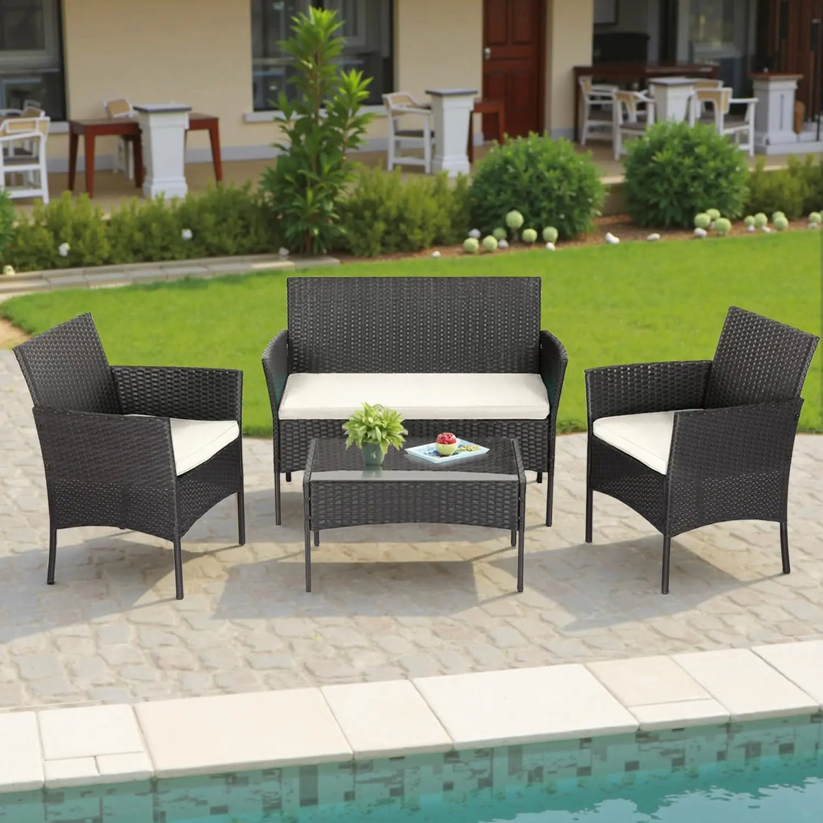Four-Piece Dark Wicker Patio Set with Cream Cushions