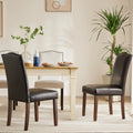 Dark Faux Leather Dining Chairs with Nailhead Trim